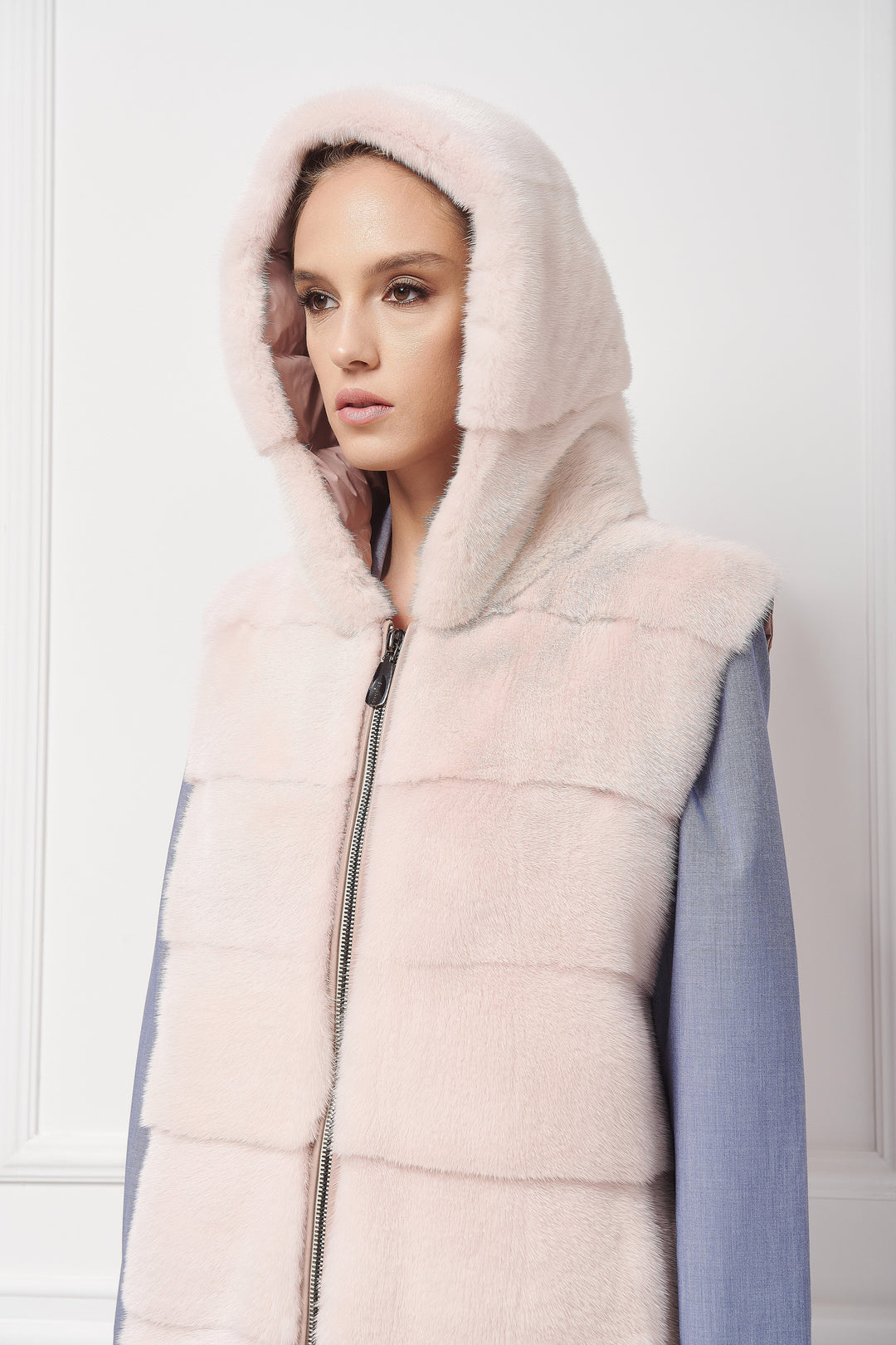 Sporty hooded down vest with mink